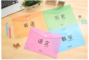 Detailed view of four colorful A4 button folders labeled by subjects on a desk