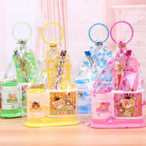 Detail of colorful Beet Bear stationery gift sets in clear bags with round handles