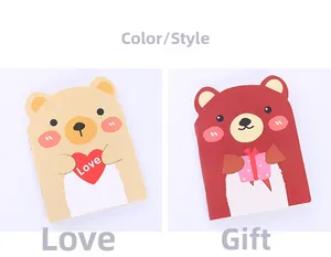Detail view of cartoon bear notebooks in heart and gift styles for stationery