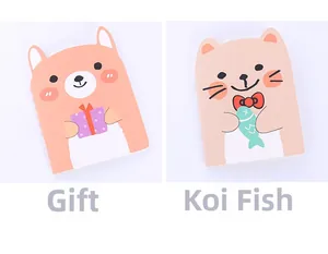 Detail of cute bear and cat shaped notebooks with gift and fish patterns