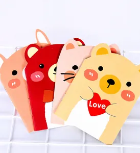 Close-up of animal-shaped mini notebooks featuring cute bear and cat designs