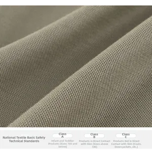 Macro shot of olive grey knit fabric texture meeting Class A infant safety standards