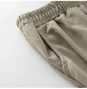 Detail of breathable honeycomb mesh fabric and elastic waistband on kids leisure pants