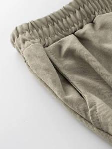 Kids breathable mosquito pants in khaki with elastic waistband and pocket detail