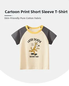 Detail of raglan sleeves and cartoon dog skateboard print on soft cotton kids T-shirt