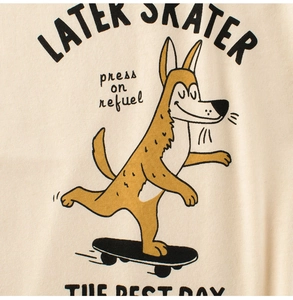 Close-up of a cream cotton T-shirt featuring a vintage skater animal print and text