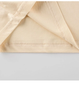 Detail of double-needle stitching and high-quality hem on kids cotton t-shirt