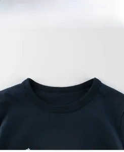 Detail of navy blue cotton T-shirt neckline with bold white HAPPY text print