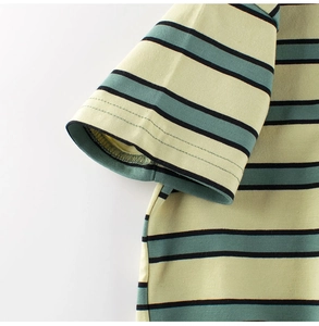 Detailed macro view of soft striped cotton knit fabric on a boys' casual short sleeve tee