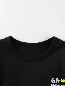 Close-up of a black cotton crew neck T-shirt with high-quality ribbed collar detailing