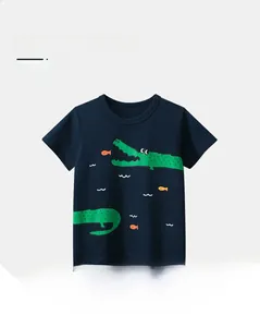 Detail of skin-friendly navy blue cotton t-shirt for boys with green crocodile print