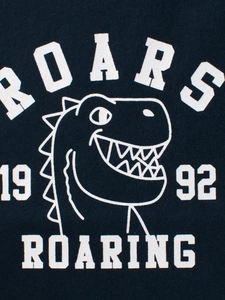 Boys short sleeve cotton T-shirt featuring a white cartoon dinosaur graphic in navy blue