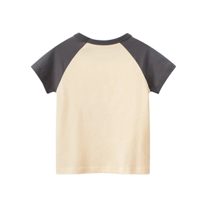 Detail of kids' raglan t-shirt featuring cream body with dark grey contrast sleeves