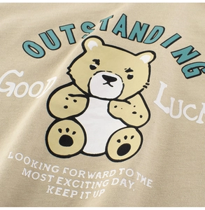 Detailed view of the cute cartoon bear print and creative slogans on a toddler cotton t-shirt