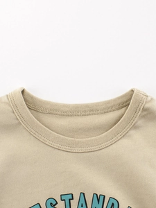 Close-up of khaki cotton knit T-shirt for boys with ribbed crew neck and letter print