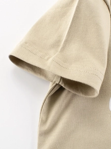 Close-up of khaki cotton boy's t-shirt showing detailed sleeve stitching and fabric
