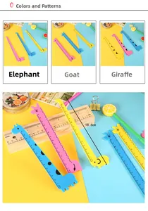 Detail of colorful cartoon elephant and giraffe rulers with dual cm and inch scales