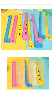 Detail view of colorful cartoon giraffe and elephant plastic rulers with clear cm markings