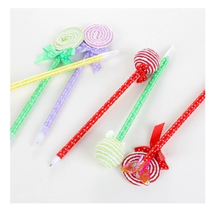 Detailed view of candy-colored lollipop ballpoint pens with silk ribbon bow decorations