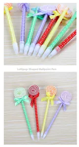 Detailed view of colorful lollipop ballpoint pens with polka dot ribbons and bows