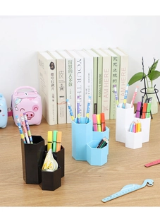 Three-grid hexagonal organizer shown in a neat desktop scene with office accessories