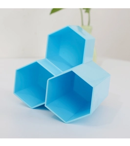 Close-up of sky blue hexagonal honeycomb storage organizer for brushes and makeup