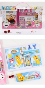Detail of pink and blue kids stationery sets with notebooks, pencils and carry case