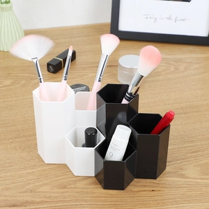 Hexagonal modular desk organizer for makeup brushes and pens in black and white finish