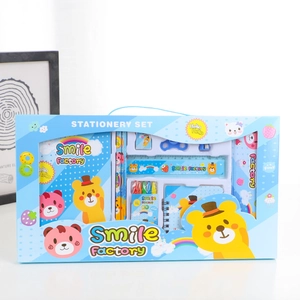 Blue stationery gift set with cartoon bear patterns including notebooks and pencils