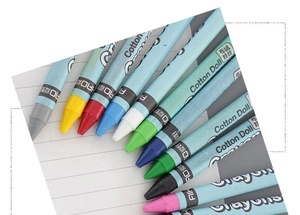 Close-up of 12-color kids drawing crayons with protective sleeves on notebook paper