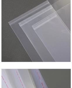 Macro shot of transparent self-adhesive book covers showing three sizes and red seal strip