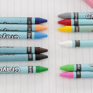 12 vibrant colors oil pastels and crayons for children drawing on notebook paper background