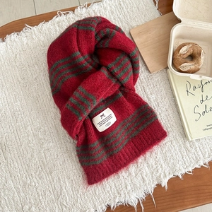 Colorful striped wool blend knitted scarf with red and green festive patterns