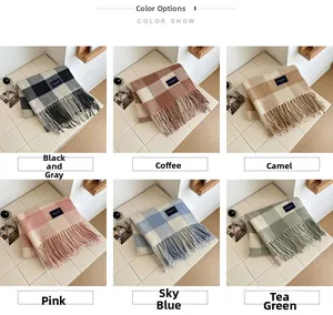 Macro detail of soft plaid scarves with tassels in various pastel and neutral colors