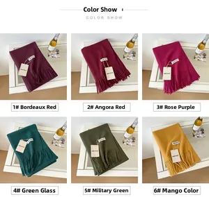Detailed grid view showing various colors of soft wool scarves with fringe tassels