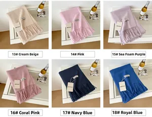 Detail showing high-quality wool scarves in diverse colors with soft tassel accents