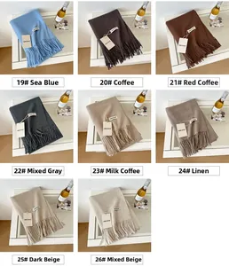 Collage of wool scarves in eight colors including sea blue and coffee with tassels