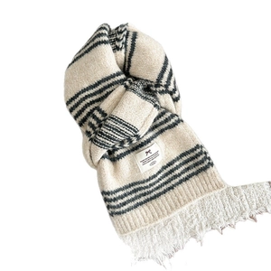 Knitted wool scarf with black stripes and tassels for winter warmth and soft texture