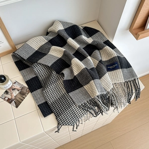 Plaid tassel scarf for women featuring black and white houndstooth pattern and elegant label