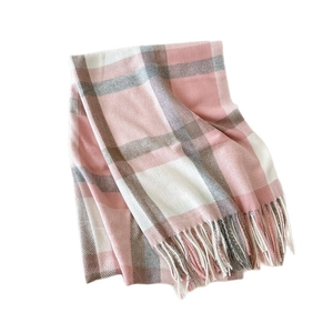 Classic British plaid scarf in pink, white, and grey with soft tassel details