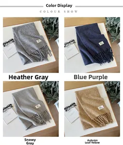 Detail showing four solid color knit scarves with tassels and GE brand labels