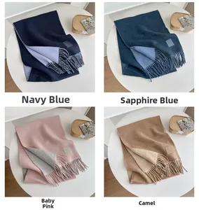 Detail view of double-sided wool scarves with tassels in various color combinations