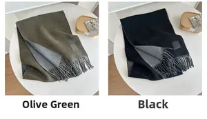 Detail of olive green and black wool scarves showing soft texture and tassel edges