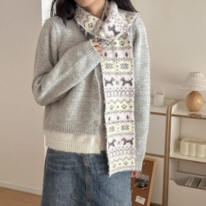 Fair Isle knit scarf with dog paw pattern worn with grey cardigan and denim skirt