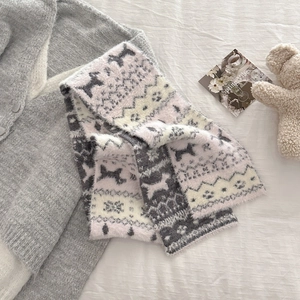 Detail of pink and grey Fair Isle knit scarf with soft fluffy texture and horse pattern