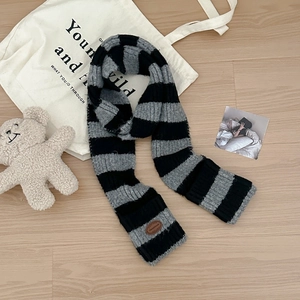 Winter wool blend knit scarf with contrast stripes and leather patch detail