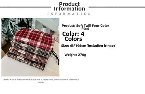 Detail view of plaid cashmere-like scarf with SHUYA-QC label and soft fringe trim