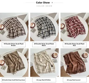 Detail of six plaid scarves with tassels in various patterns like stripes and large checks