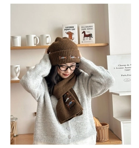 Brown wool knit beanie and scarf set featuring cute dachshund embroidery for winter warmth