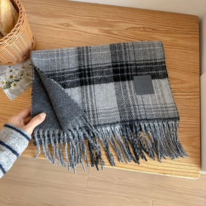 Classic grey plaid wool blend scarf with fringe edges and premium leather label